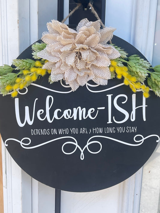 Welcome-Ish wooden hanging sign